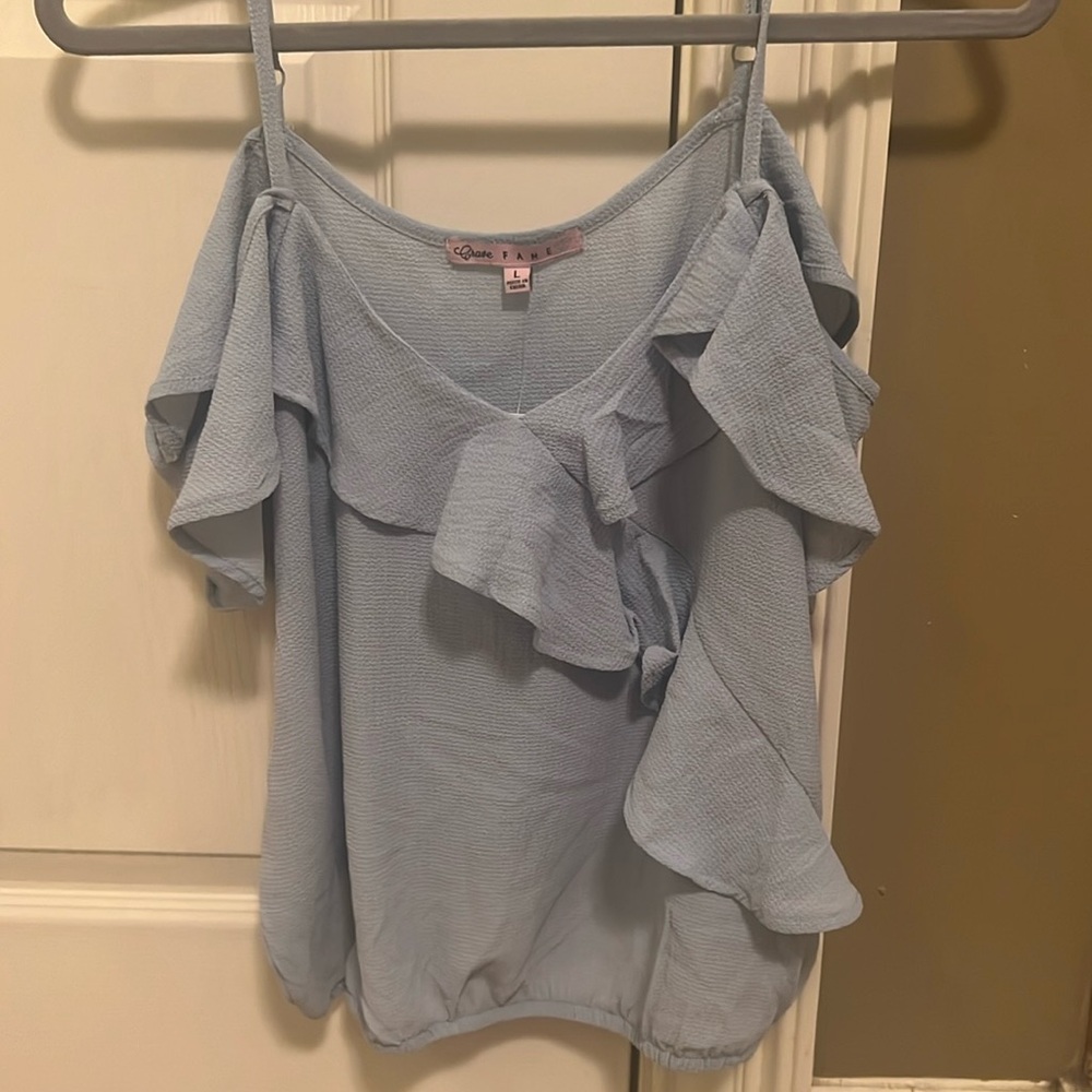 light blue off the shoulder top lined waistband at the bottom. Unworn.